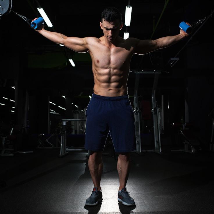 Interior of a professional gym with weight training equipment and mirrors
